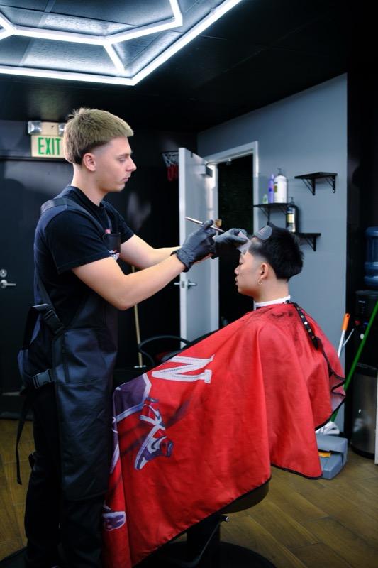 Hot towel shave preparation at Tay's Barbershop